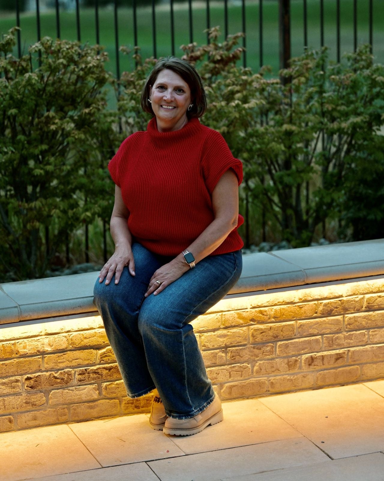 The owner of Out West Chic boutique dressed in a red sweater